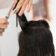 A woman getting her hair done at Hair By Mario in Randburg.