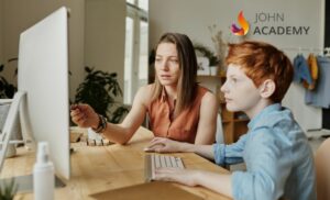 A woman helping a child with their school work