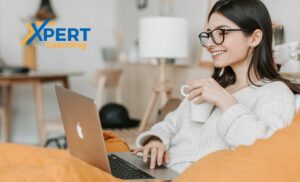 A woman completing an online project management course from Xpert Learning