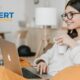 A woman completing an online project management course from Xpert Learning