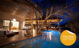 The pool area at night at Moditlo River Lodge in Hoedspruit