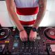 A DJ playing music at his table