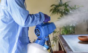 A stock photo of someone doing a fumigation session in an apartment