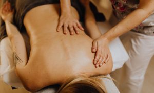 A stock photo of a woman receiving a massage