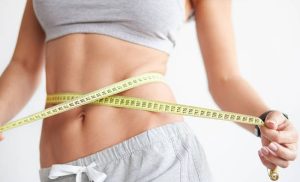 A stock photo of a woman after having an ultrasonic cavitation treatment
