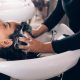 A stock photo of a woman getting her hair washed at a hair salon