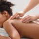 A stock photo of a woman getting a back exfoliation at the spa