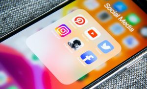 A stock photo of a phone open on a social media folder