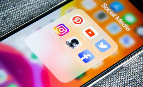 A stock photo of a phone open on a social media folder