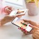 A stock photo of two women using Instagram on their phones