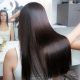 A stock photo of a woman receiving a Brazilian blowout