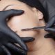 A stock photo of a woman during dermaplaning at the spa