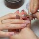 A stock photo of a woman getting her nails done at the salon