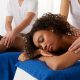 A stock photo of a couple enjoying a massage at the spa