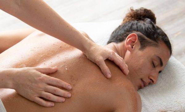 A stock photo of a man getting a massage at the spa