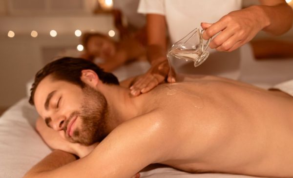 A stock photo of a couple getting a massage at the spa