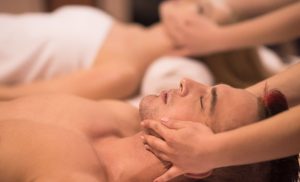 A stock photo of a couple having a massage at the spa