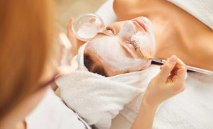 A stock photo of a woman getting a facial at the spa