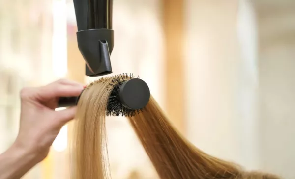 A Sleek Wash, Blow-dry and Flat Iron Treatment